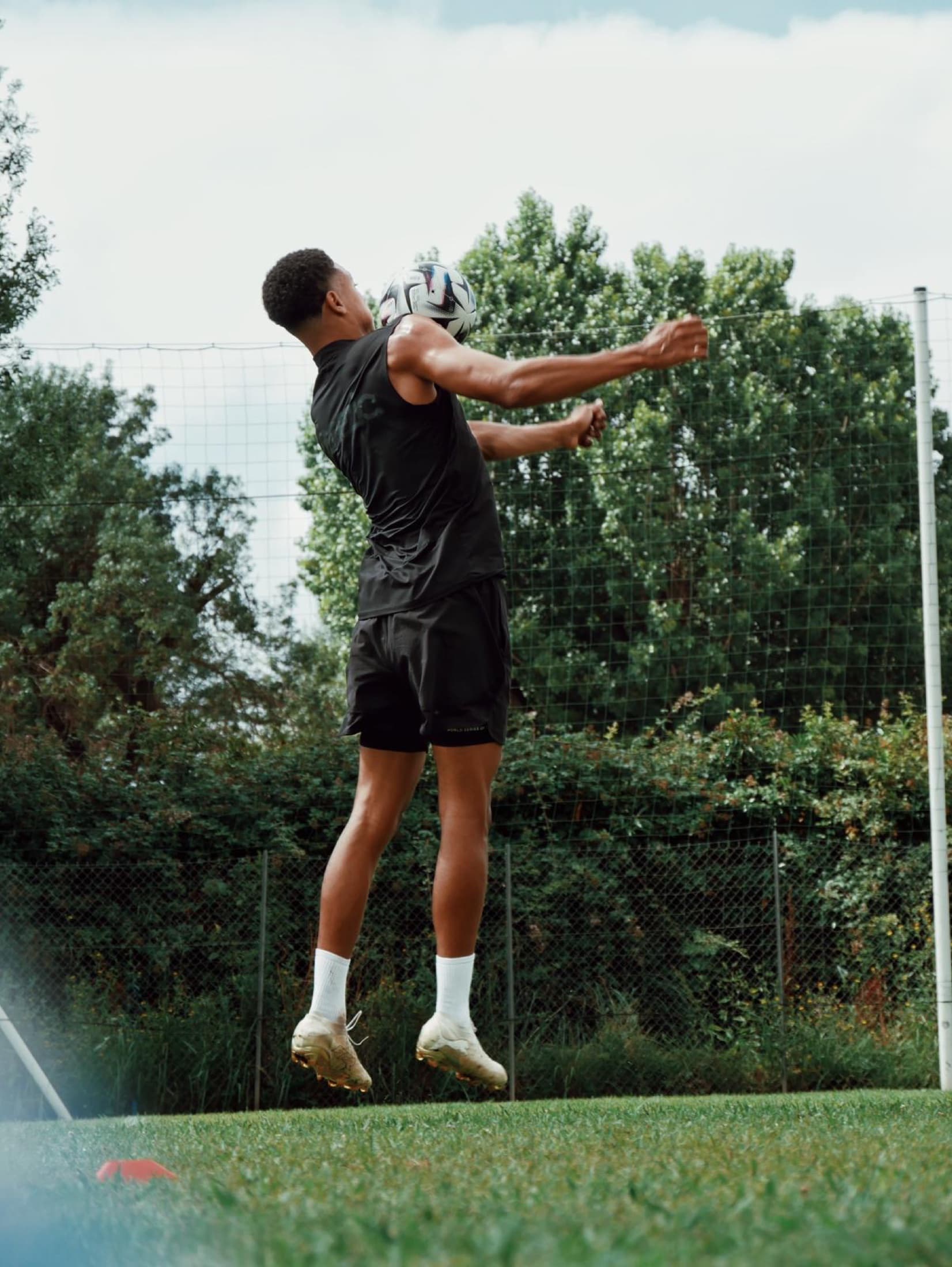 Professional player jumping to head the ball